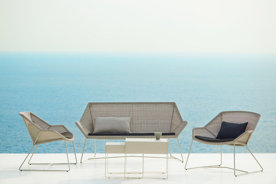 Breeze Lounge Chair by Cane-Line, showing breeze lounge chairs in live shot.