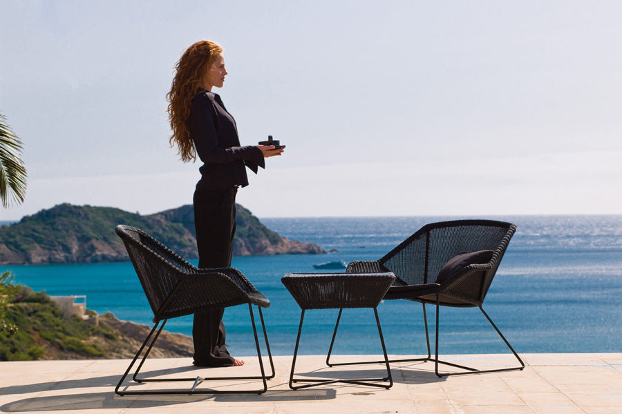 Breeze Lounge Chair by Cane-Line, showing breeze lounge chairs in live shot.