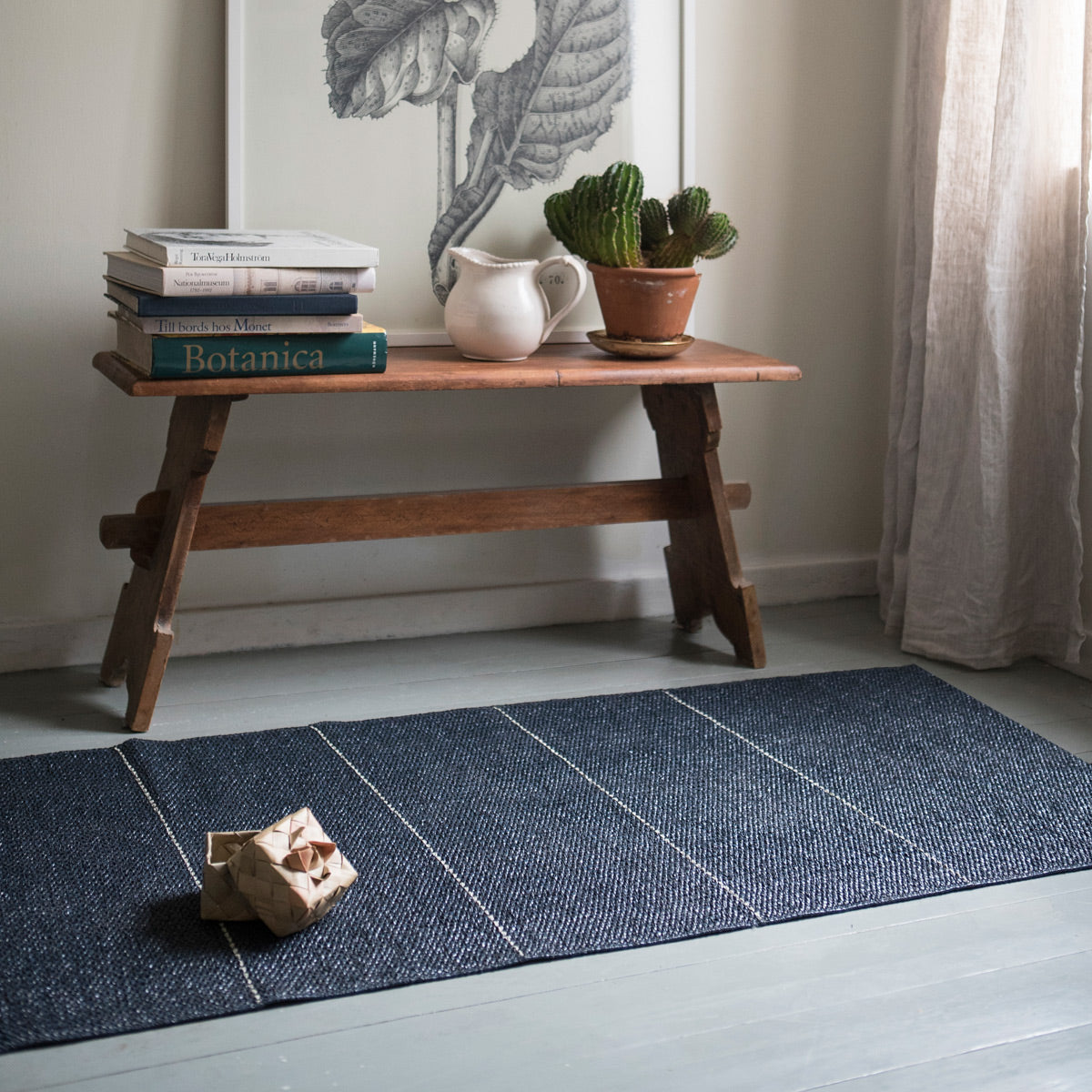 Brielle Woven Plastic Rug by Brita, showing brielle woven plastic rug in live shot.