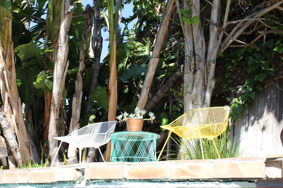 Bunny Lounge Chair by Bend, showing bunny lounge chairs with table in live shot.