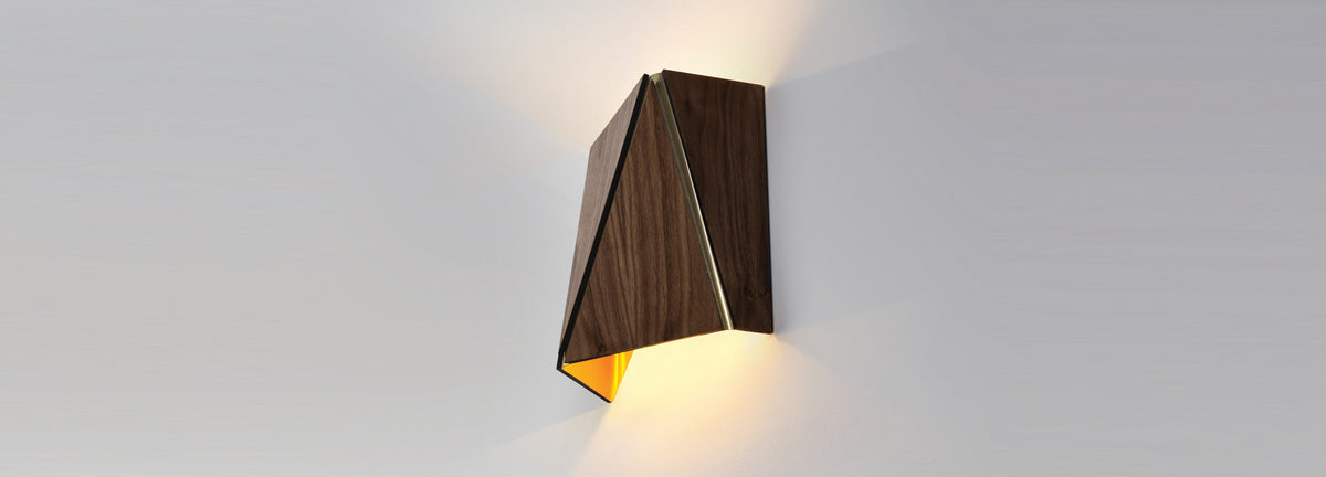 Calx LED Sconce by Cerno, showing angle view of calx dark stained walnut led sconce in live shot.