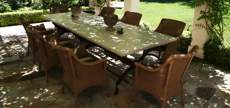 James De Wulf Campaign Dining Table by De Wulf, showing campaign dining table with chairs in live shot.