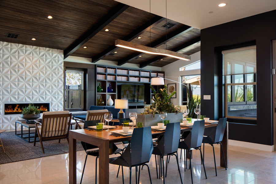 Camur LED Linear Pendant by Cerno, showing camur led linear pendant with table & chair in live shot.