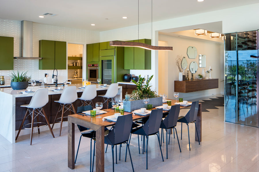 Camur LED Linear Pendant by Cerno, showing camur led linear pendant with table & chair in live shot.