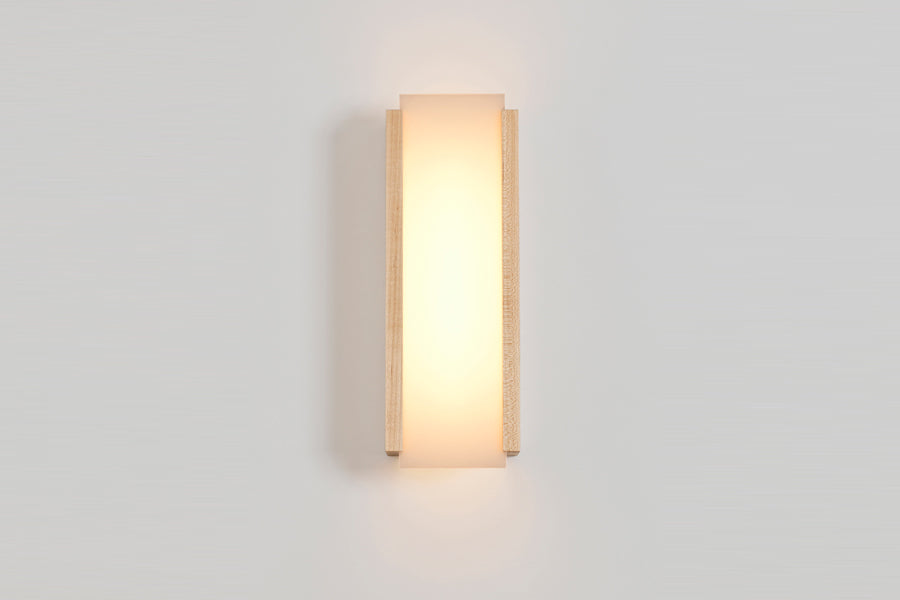 Capio LED Sconce by Cerno, showing front view of small maple capio led sconce in live shot.