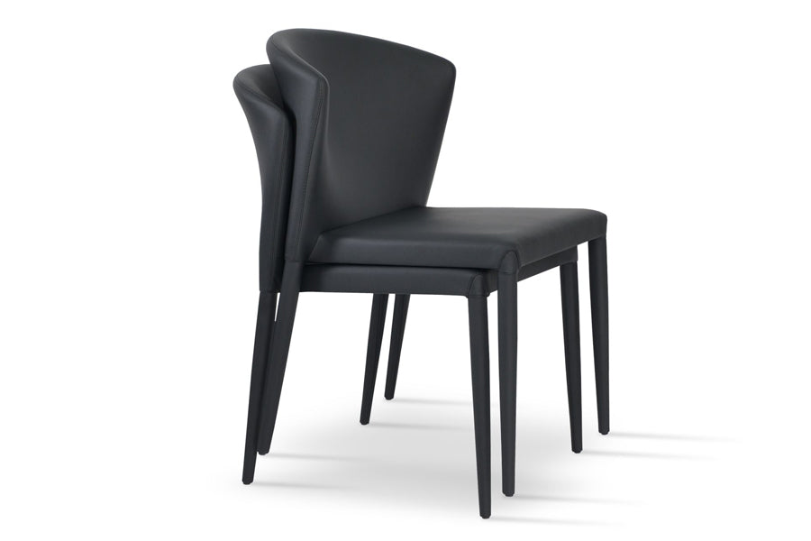 Capri Full Upholstered Stackable Chair by SohoConcept, showing angle view of two chairs in black ppm.