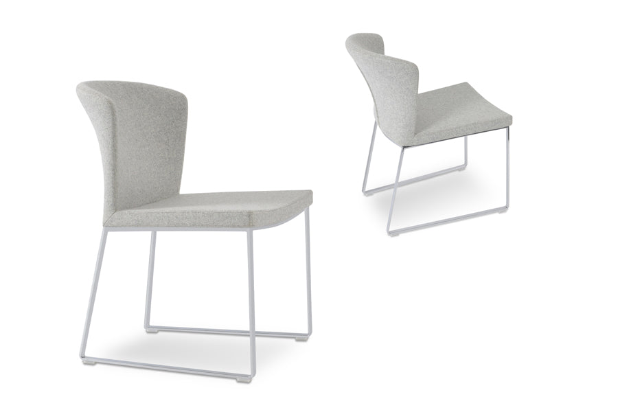 Capri Sled Dining Chair by SohoConcept, showing two chairs in camira blazer silver wool with brushed stainless steel base.