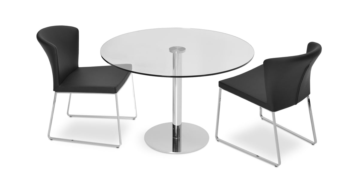Capri Sled Dining Chair by SohoConcept, showing two chairs in black leatherette with chrome base and tango glass dining table.