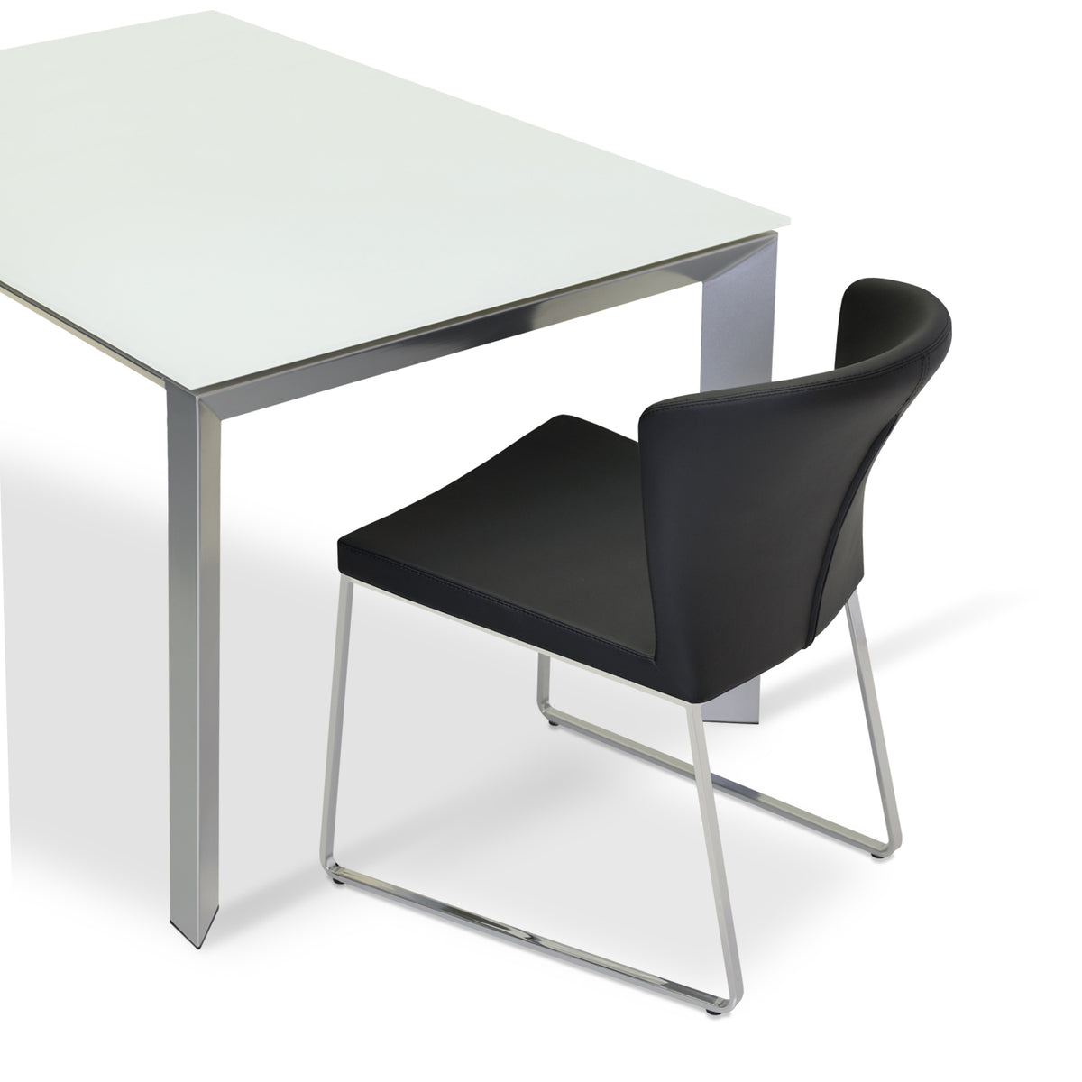 Capri Sled Dining Chair by SohoConcept, showing chair in black ppm with chrome base and milano extendable table.