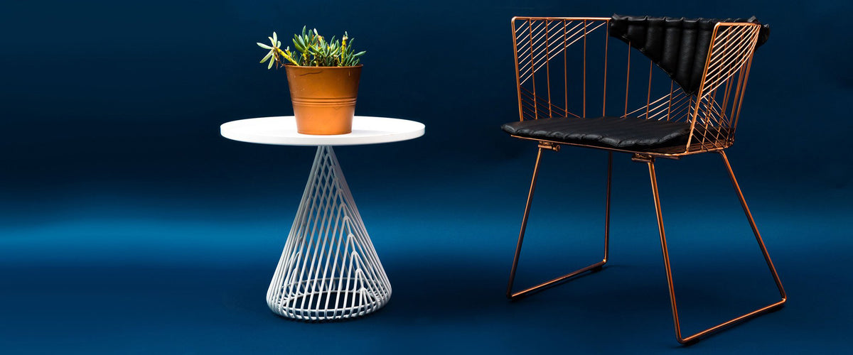Captain Chair by Bend, showing captain chair with table in live shot.