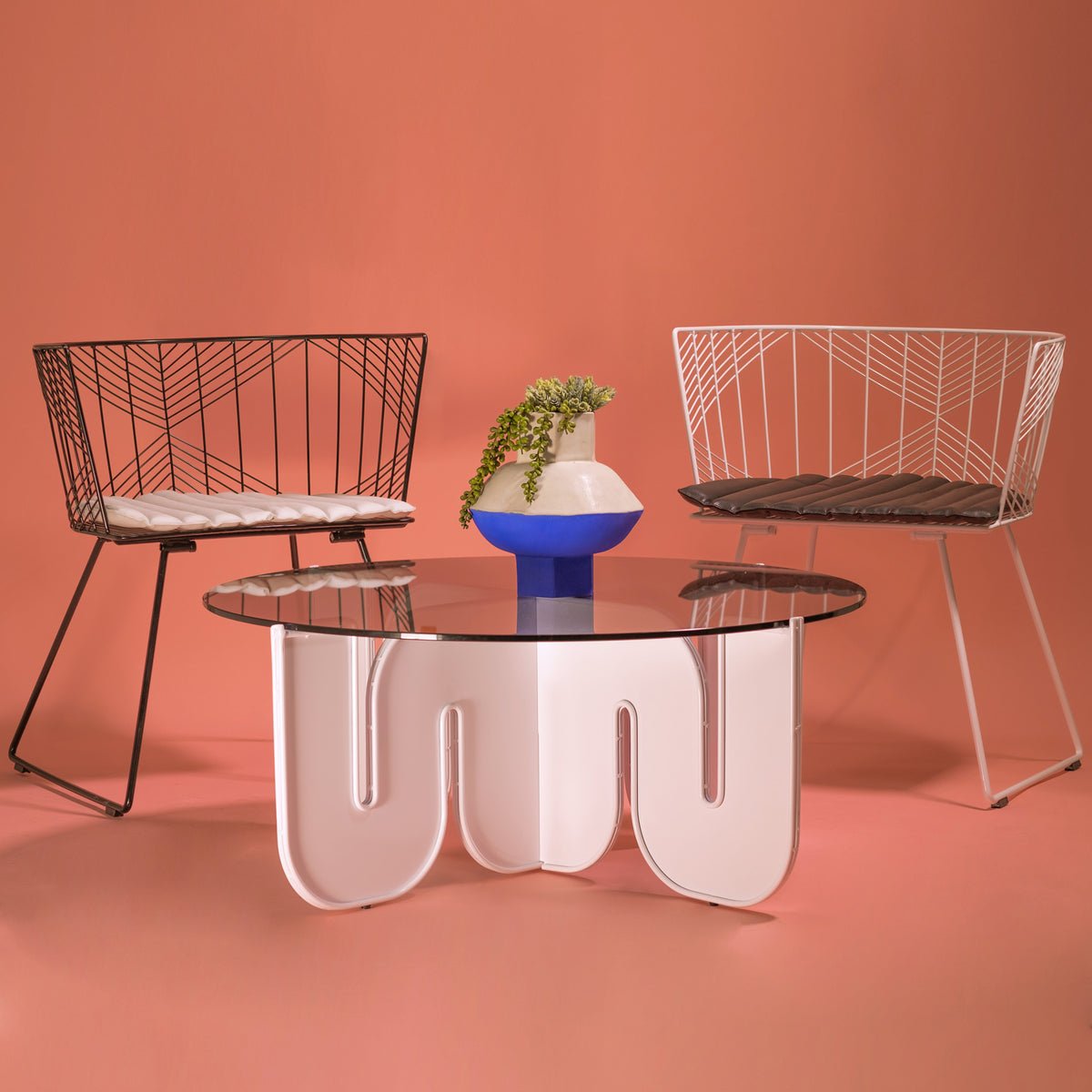 Captain Chair by Bend, showing captain chairs with table in live shot.