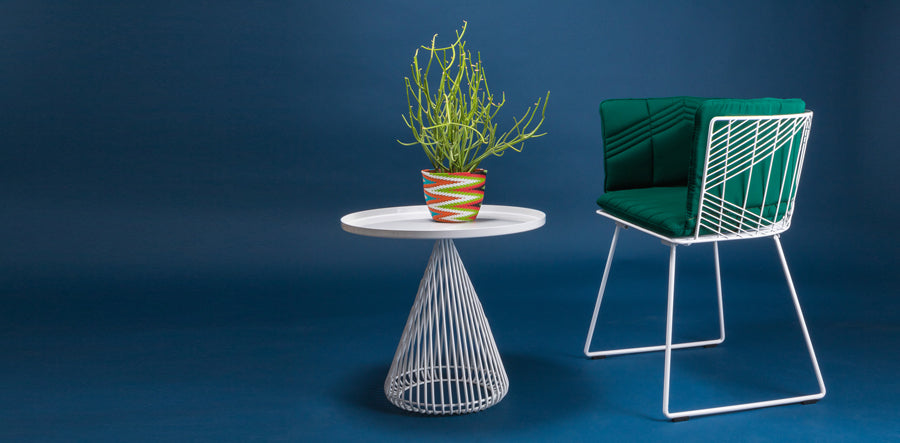 Captain Chair by Bend, showing captain chair with table in live shot.