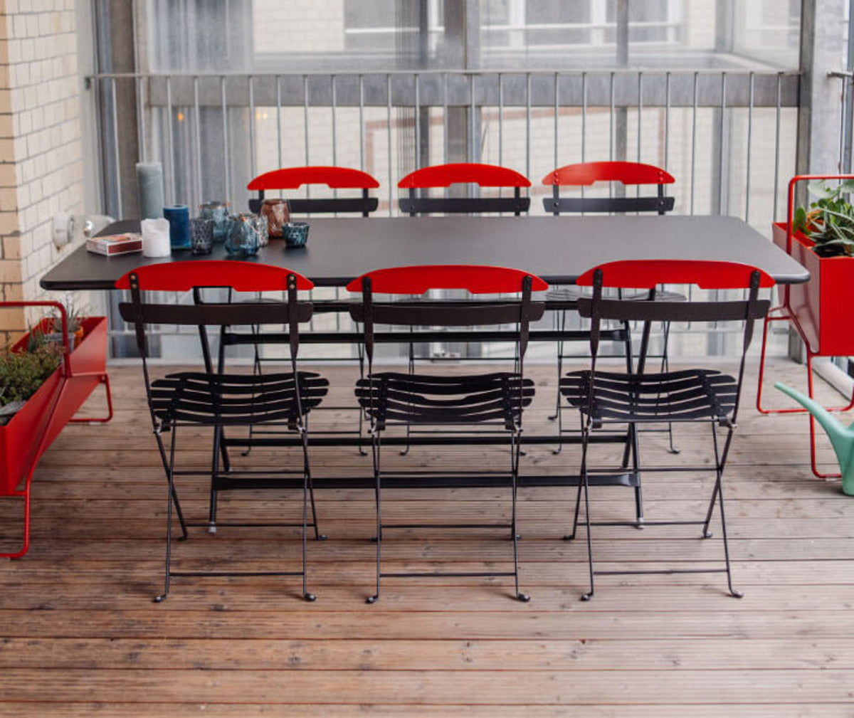 Caractere Tables by Fermob, showing angle view of table with chairs in the live shot.