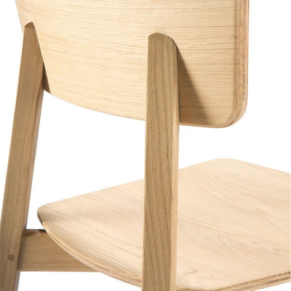 Casale Dining Chair by Ethnicraft, showing closeup view of dining chair in varnished natural oak finish.