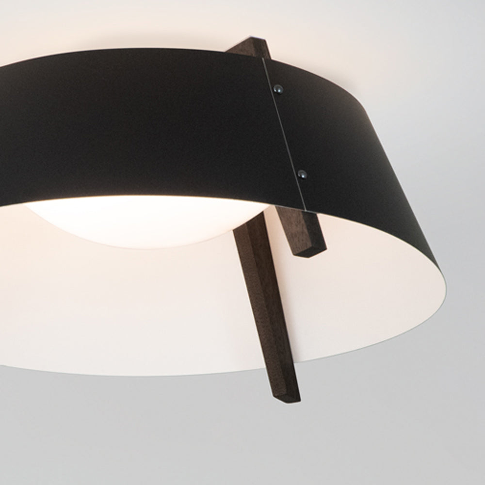 Casia Flushmount by Cerno - showing detail view of casia flushmount in matte black/white interior shade + dark stained walnut wood.