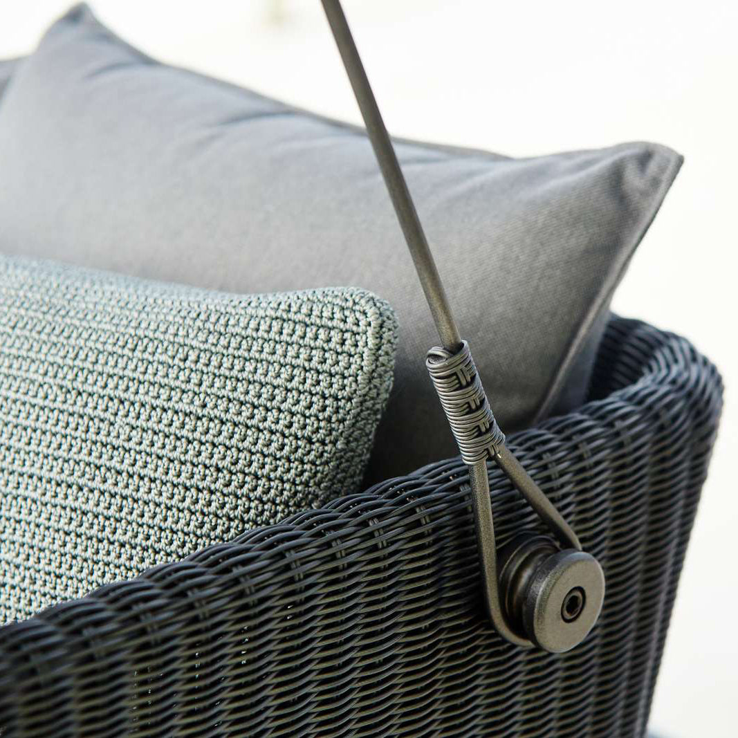 Cave Outdoor Swing Sofa by Cane-Line, showing cave outdoor swing sofa in live shot.