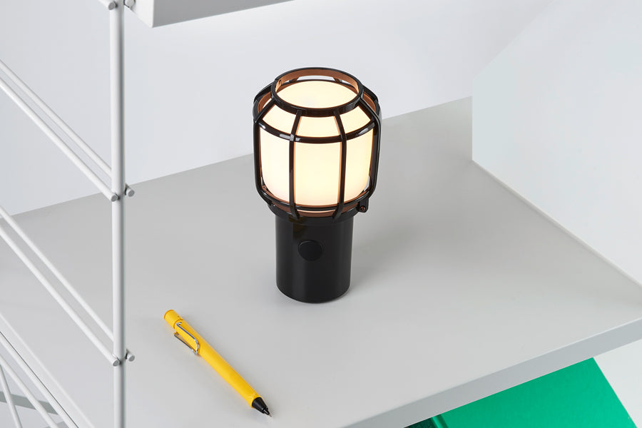 Chispa Portable Lamp by Marset, showing chispa portable lamp in live shot.