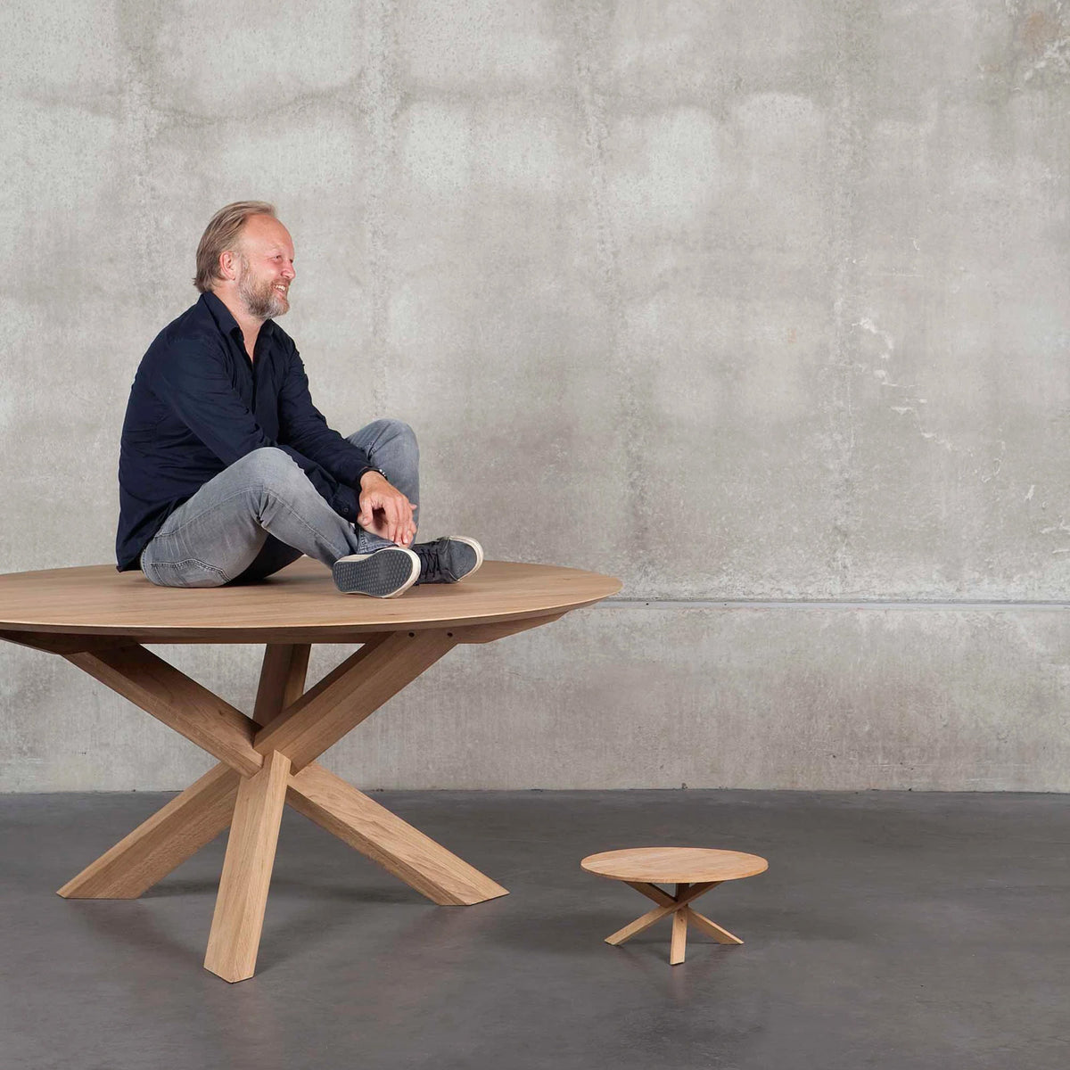 Circle Dining Table by Ethnicraft, showing circle dining table in the live shot.