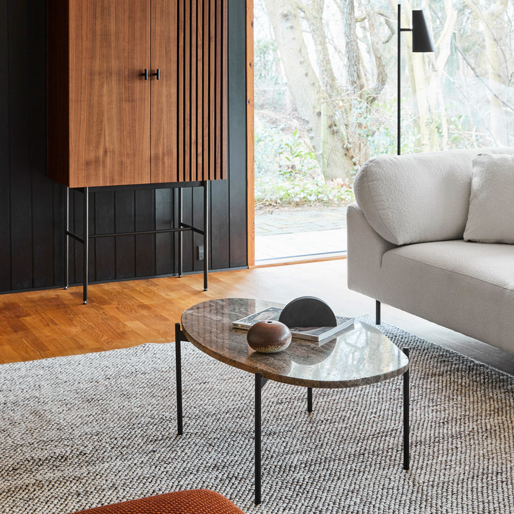 Collar Open End 1 Arm Sofa by Woud, showing closeup view of collar open end 1 arm sofa in live shot.