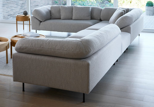 Collar Open End 1 Arm Sofa by Woud, showing collar open end 1 arm sofas in live shot.