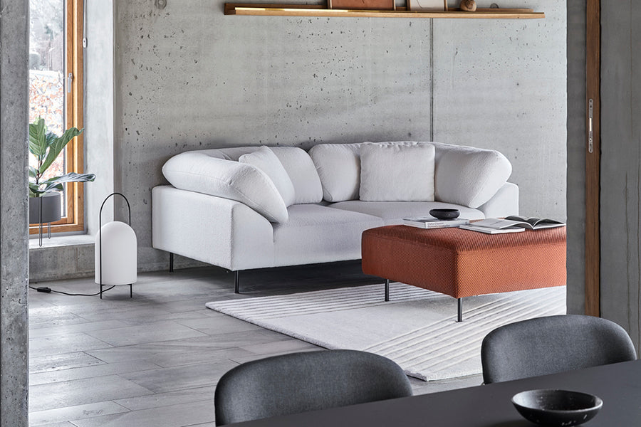 Collar Ottoman by Woud, showing collar ottoman in live shot.