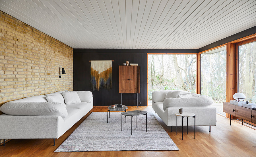 Collar Sofa by Woud, showing collar sofas in live shot.