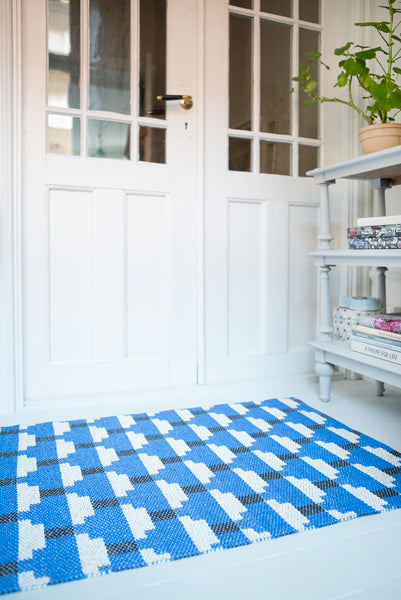 Confect Woven Plastic Rug by Brita, showing closeup view of confect woven plastic rug in live shot.