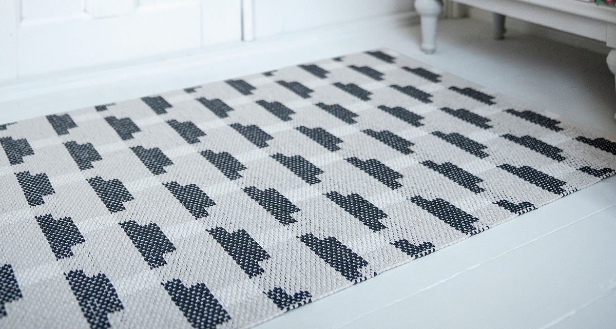 Confect Woven Plastic Rug by Brita, showing confect woven plastic rug in live shot.