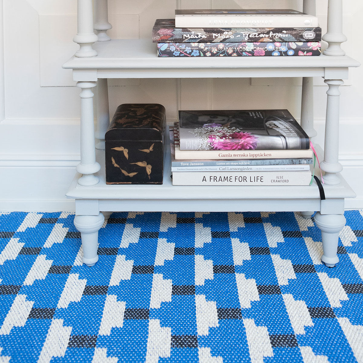 Confect Woven Plastic Rug by Brita, showing closeup view of confect woven plastic rug in live shot.