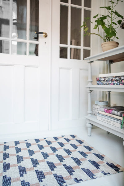 Confect Woven Plastic Rug by Brita, showing closeup view of confect woven plastic rug in live shot.