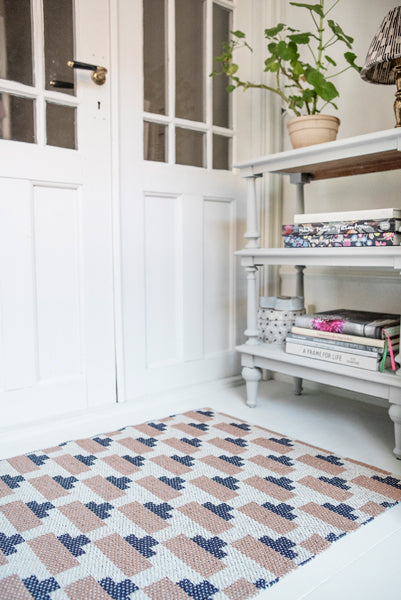 Confect Woven Plastic Rug by Brita, showing closeup view of confect woven plastic rug in live shot.