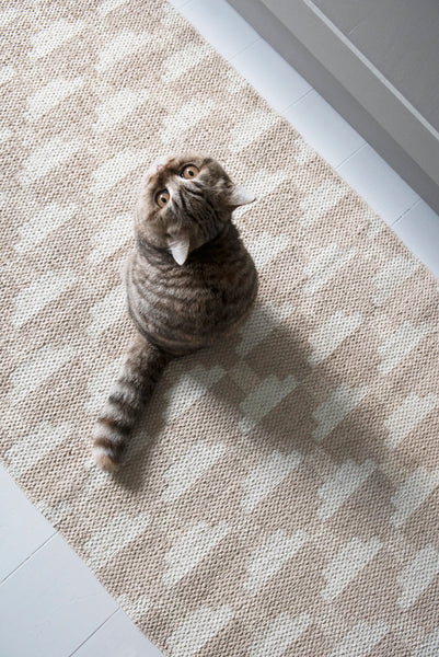 Confect Woven Plastic Rug by Brita, showing closeup view of confect woven plastic rug in live shot.
