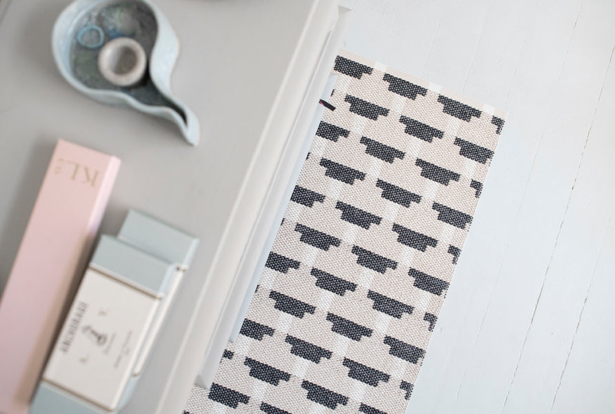 Confect Woven Plastic Rug by Brita, showing confect woven plastic rug in live shot.