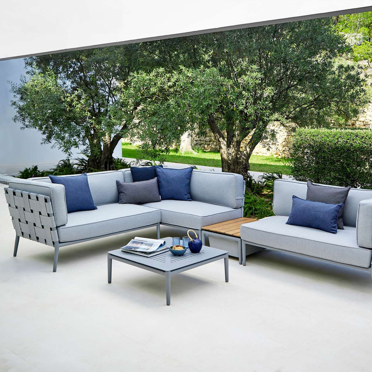 Conic Coffee Table by Cane-Line, showing conic coffee table in live shot.