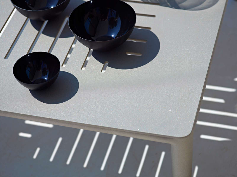 Conic Coffee Table by Cane-Line, showing closeup view of conic coffee table in live shot.