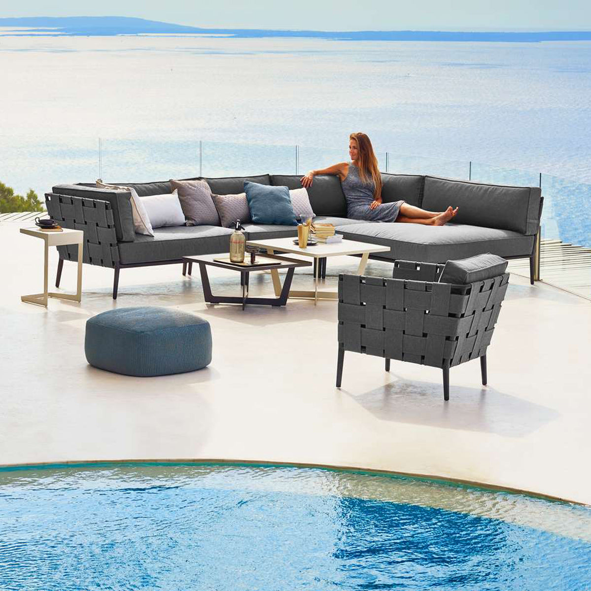 Conic Daybed Module by Cane-Line, showing conic daybed module with table in live shot.
