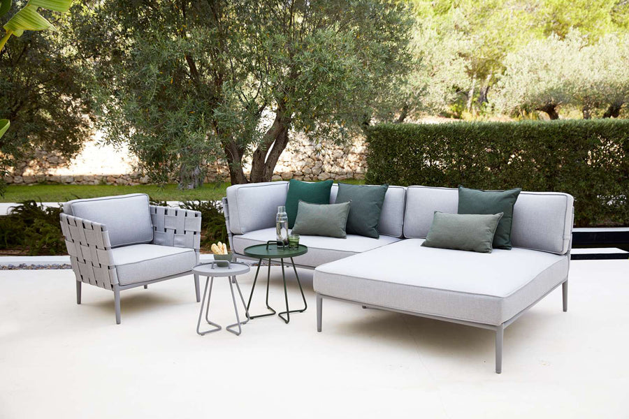 Conic Daybed Module by Cane-Line, showing conic daybed module with table in live shot.