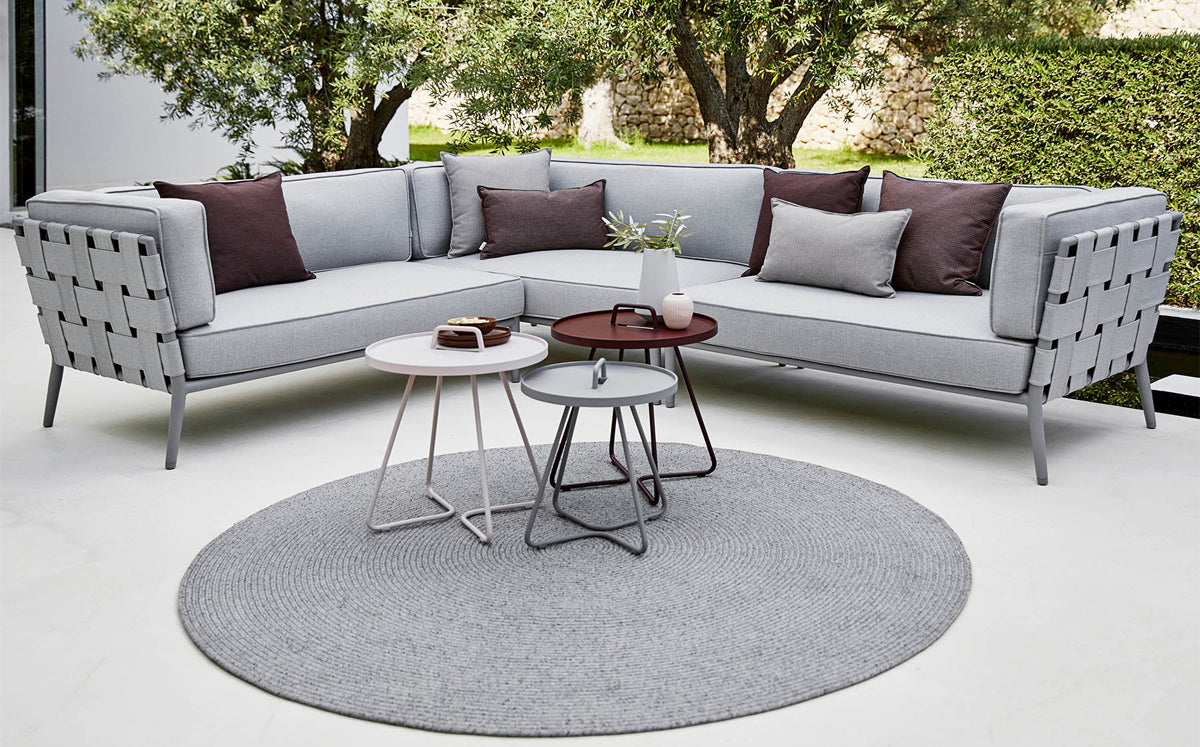 Conic Outdoor Module by Cane-Line, showing conic outdoor modules with tables in live shot.