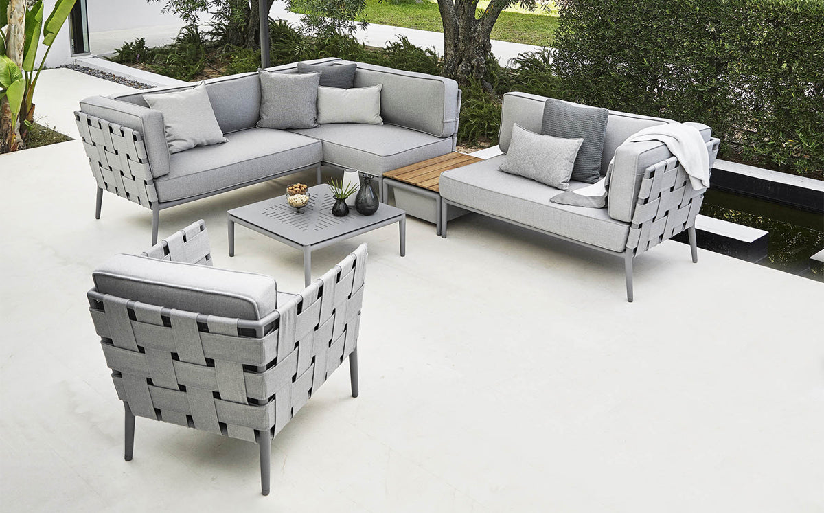 Conic Outdoor Lounge Chair by Cane-Line, showing conic outdoor lounge chair in live shot.