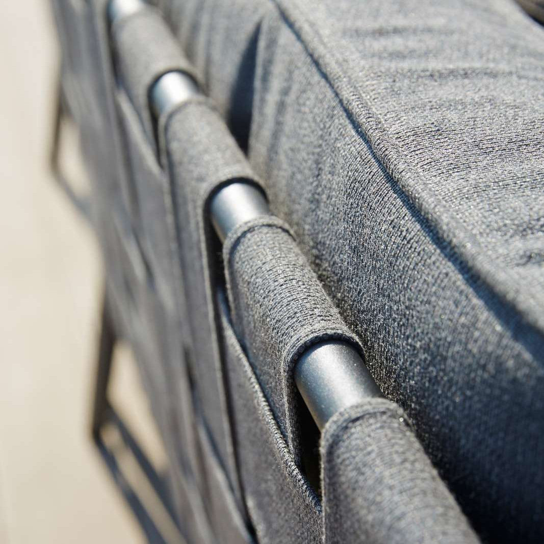 Conic Outdoor Lounge Chair by Cane-Line, showing closeup view of conic outdoor lounge chair in live shot.