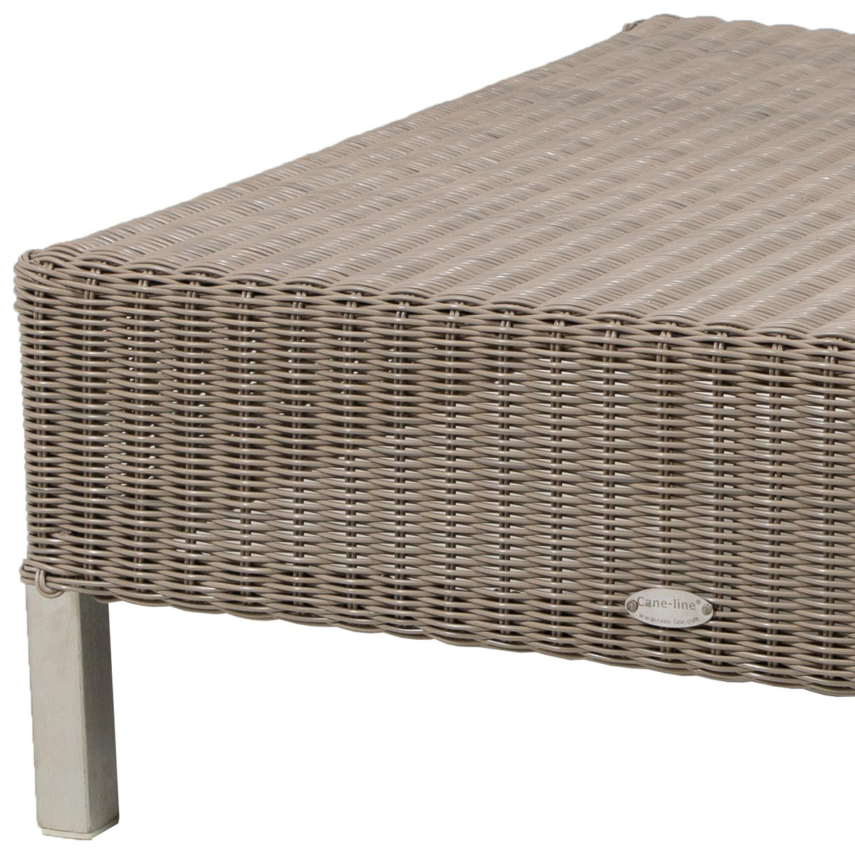 Connect Footstool by Cane-Line, showing closeup view of connect footstool in taupe weave/no cushion.