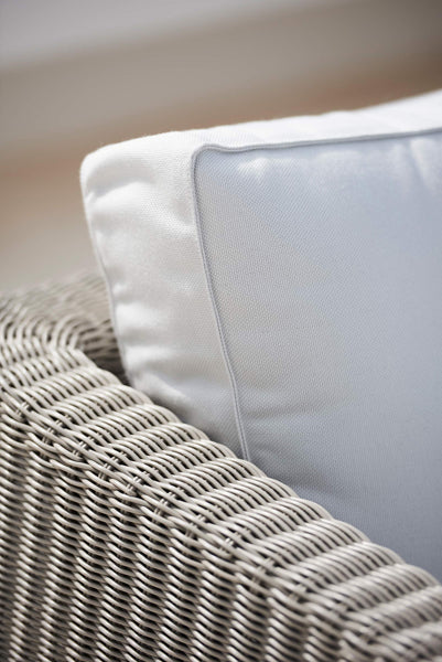 Connect Lounge Chair by Cane-Line, showing closeup view of connect lounge chair in live shot.