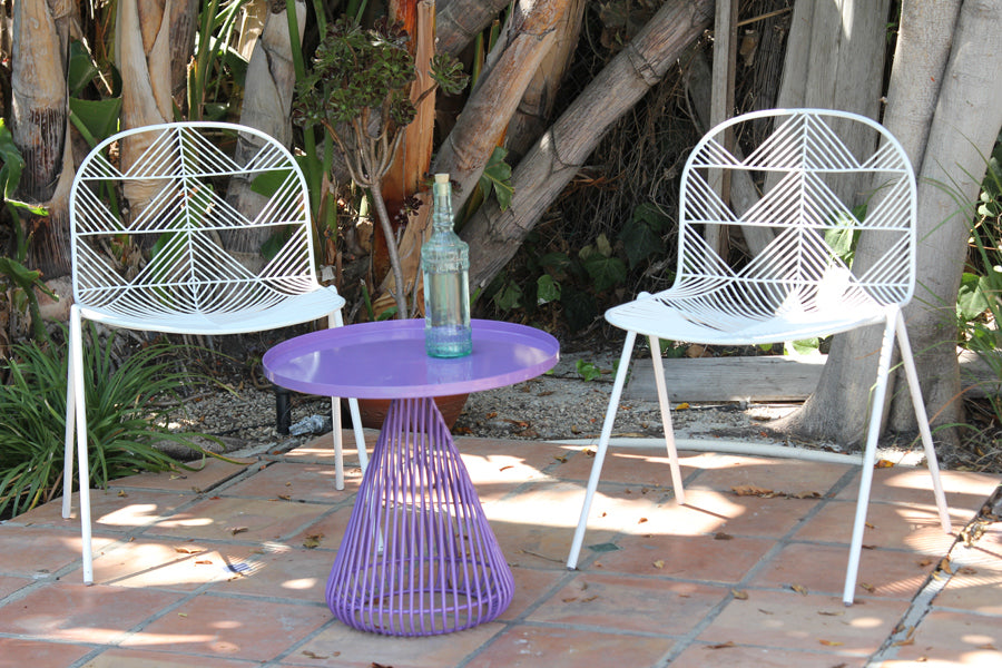 Cono Side Table by Bend, showing cono side table with chairs in live shot.