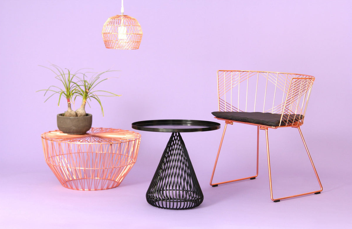 Cono Side Table by Bend, showing cono side table with chair & table in live shot.