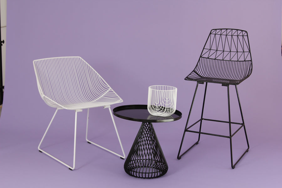 Cono Side Table by Bend, showing cono side table with chairs in live shot.