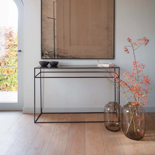Console Table by Ethnicraft, showing front view of console table in live shot.