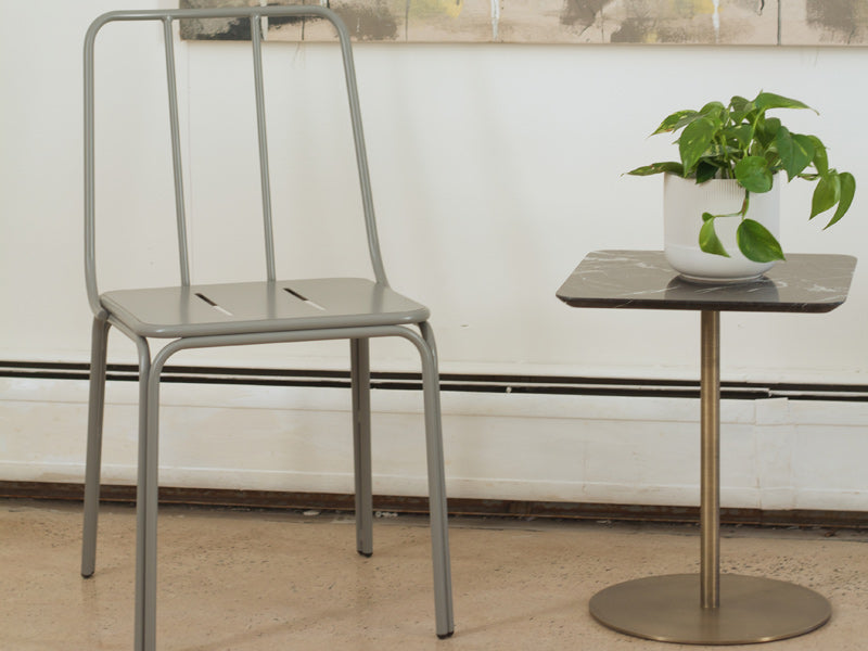 Conti Chair by Kollektiff, showing of conti chair with table in live shot.