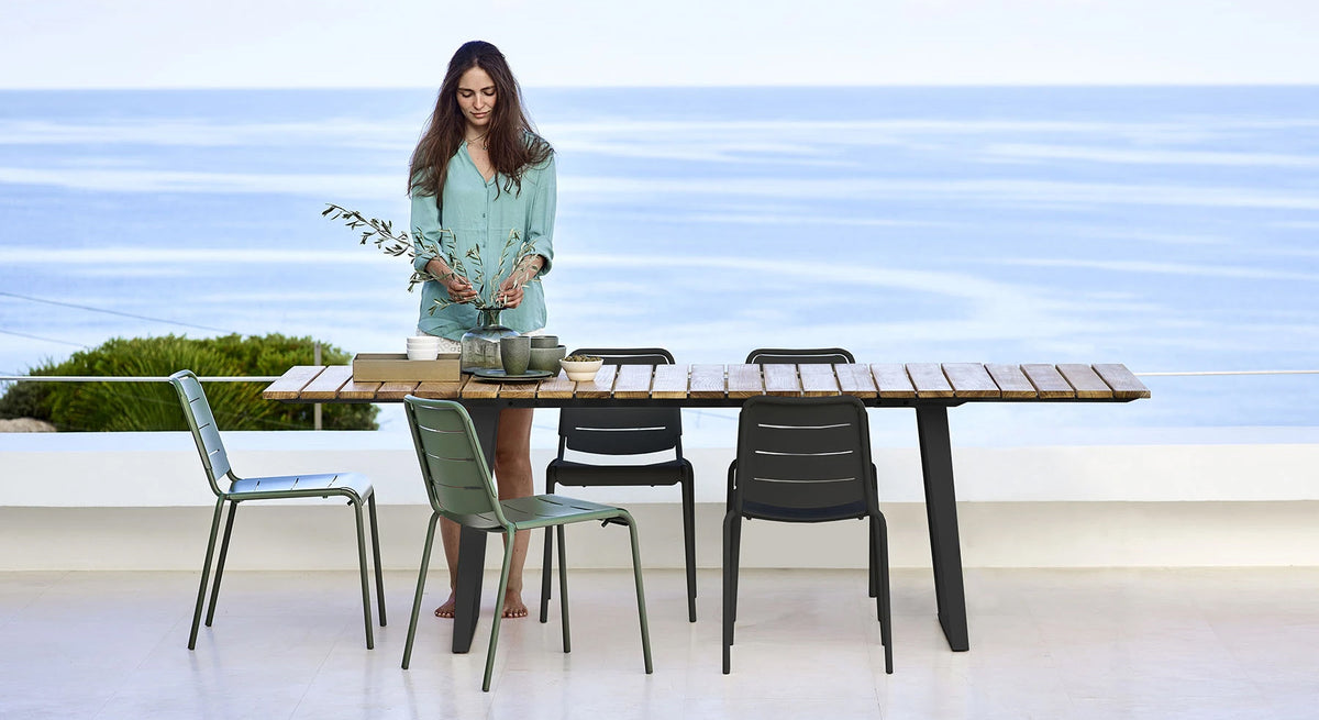 Copenhagen Dining Table w/ Extension by Cane-Line, showing dining table with chairs in live shot.