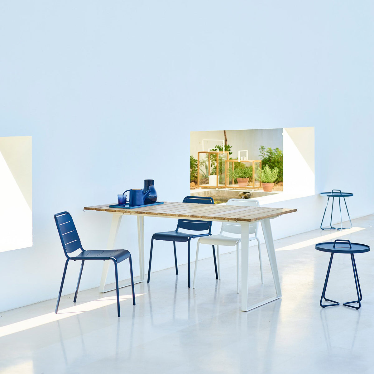 Copenhagen Dining Table w/ Extension by Cane-Line, showing dining table with chairs in live shot.