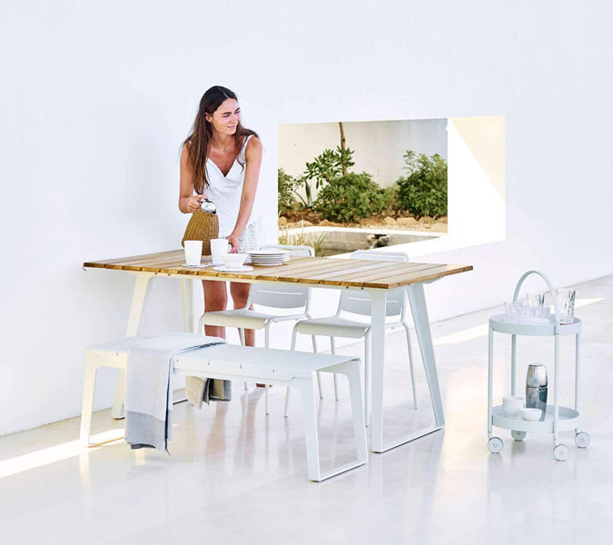 Copenhagen Dining Table w/ Extension by Cane-Line, showing dining table with chairs in live shot.